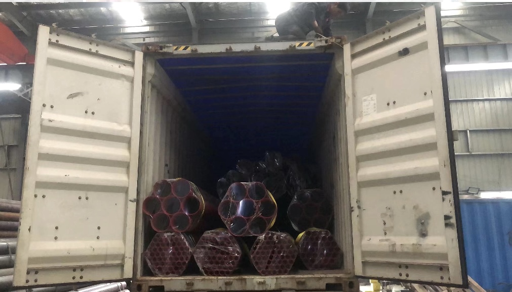 fire‑sprinkler‑pipe‑large‑bundles‑stored‑inside‑factory‑workshop